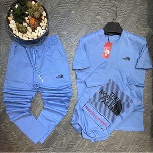 Blue & Black North face jogger set. It fits true to size.